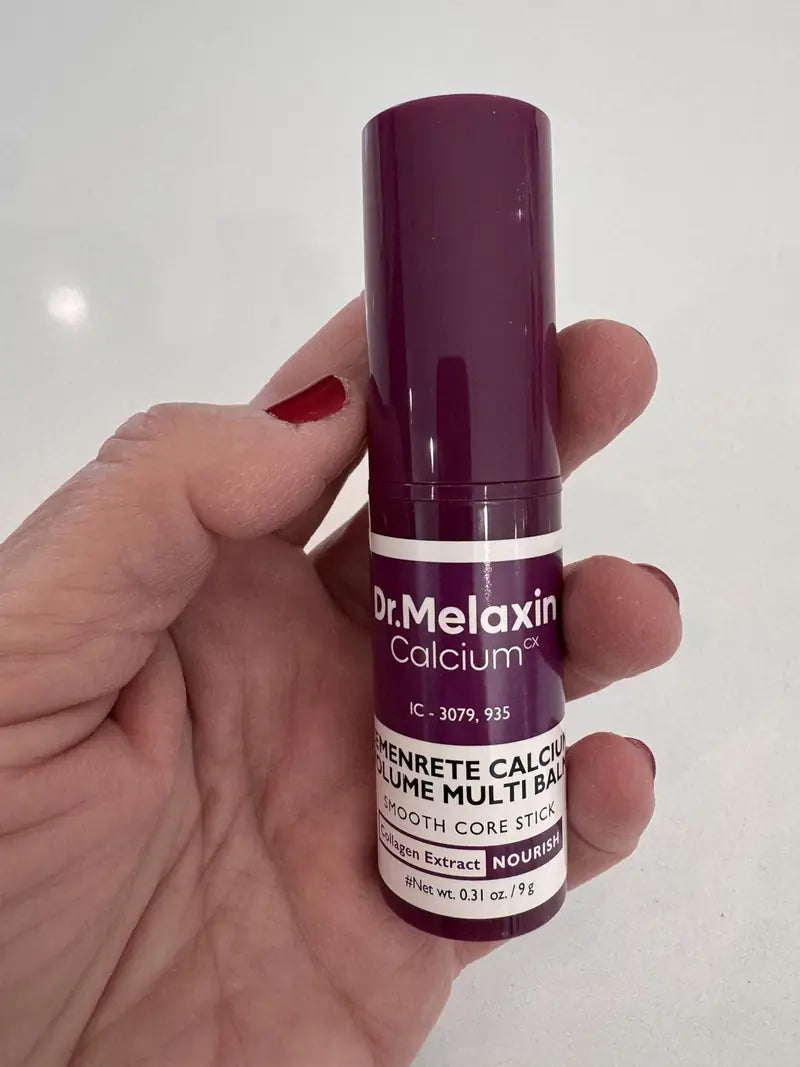 Bálsamo Dr. Melaxin real en la mano, etiqueta Cemenrete Calcium Volume Multi Balm
